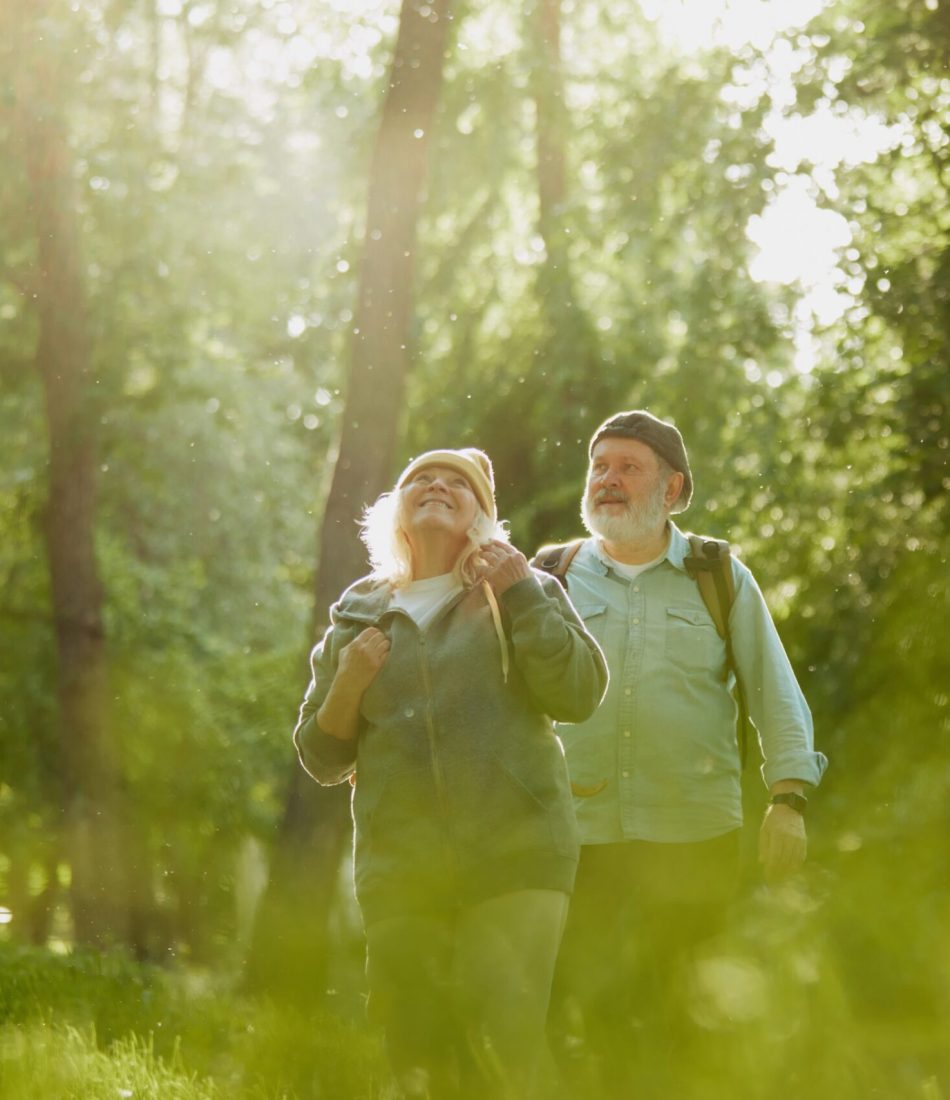 Senior,Couple,,Man,And,Woman,Taking,Peaceful,Walk,In,Park,